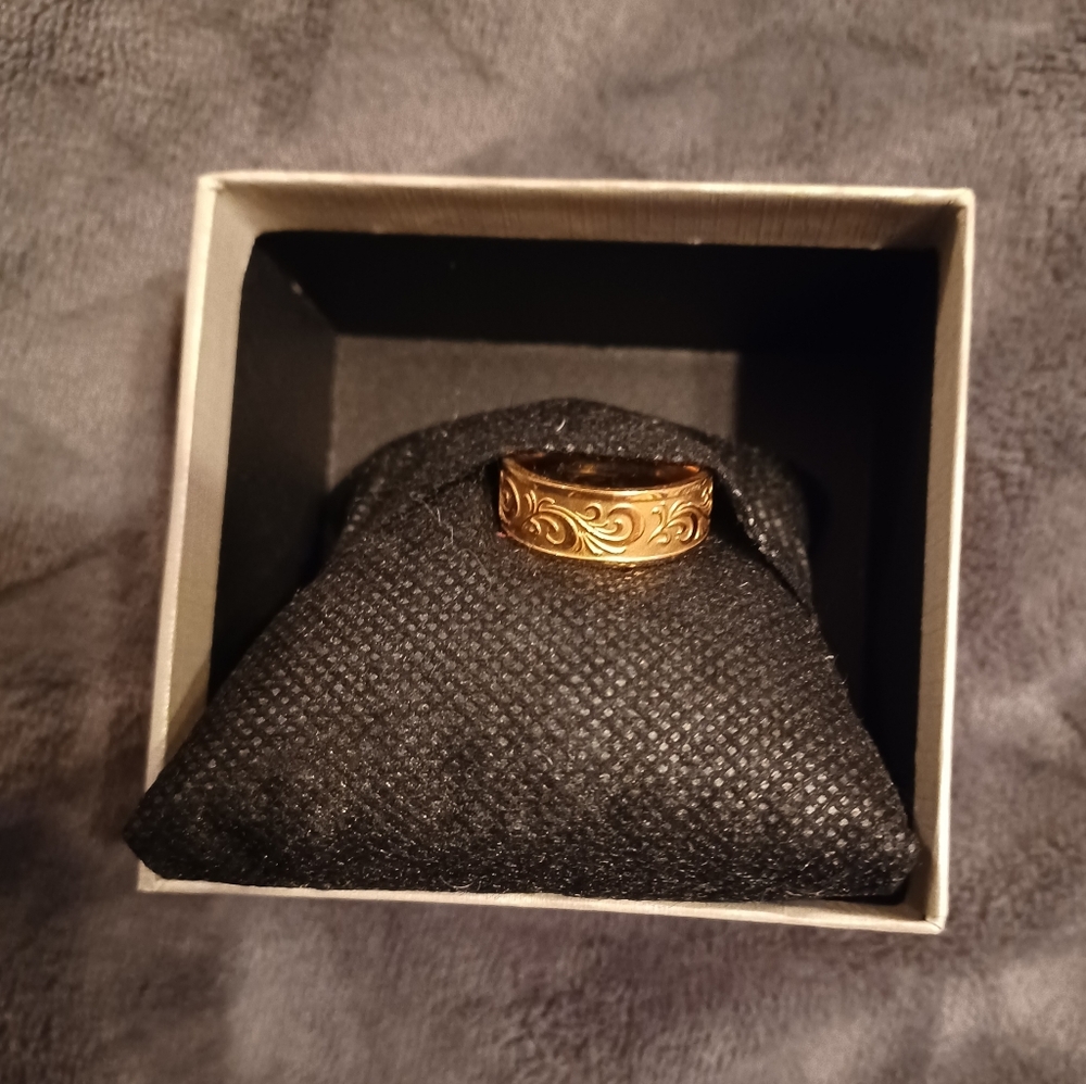 18k gold over stainless steel. Size 8.